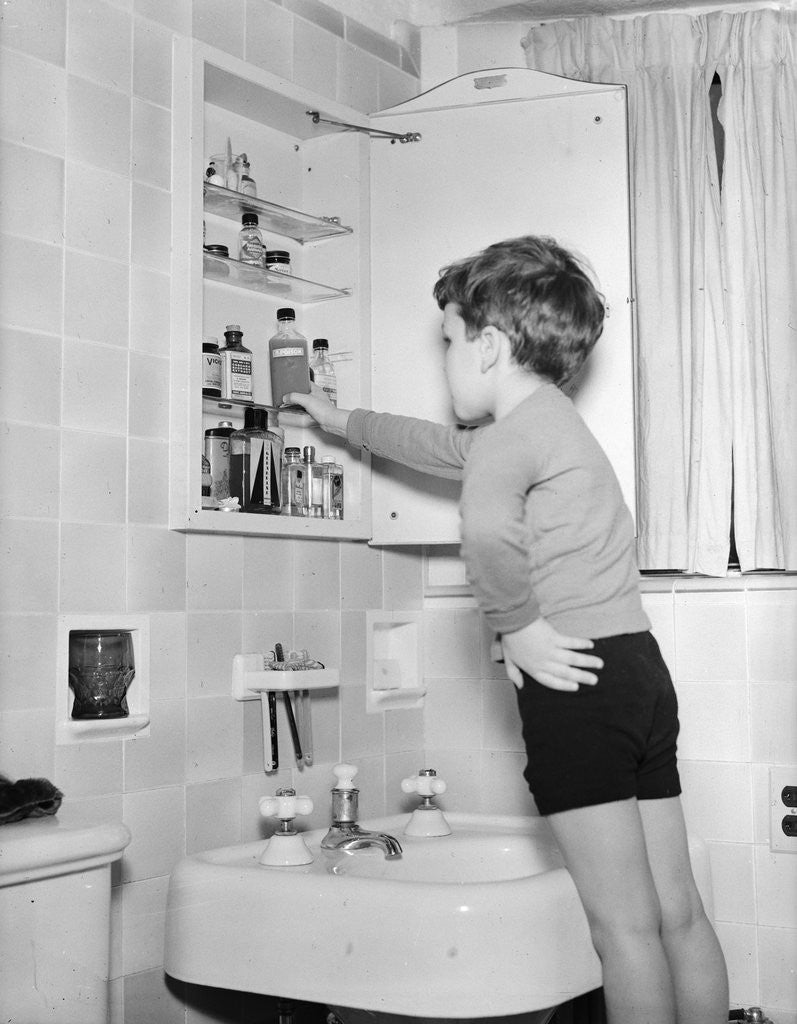 Detail of Boy Reaching into Medicine Cabinet by Anonymous