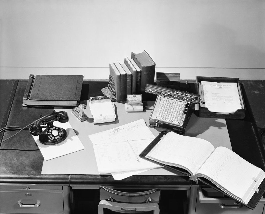 Detail of Desk Covered with Assorted Office Supplies by Anonymous