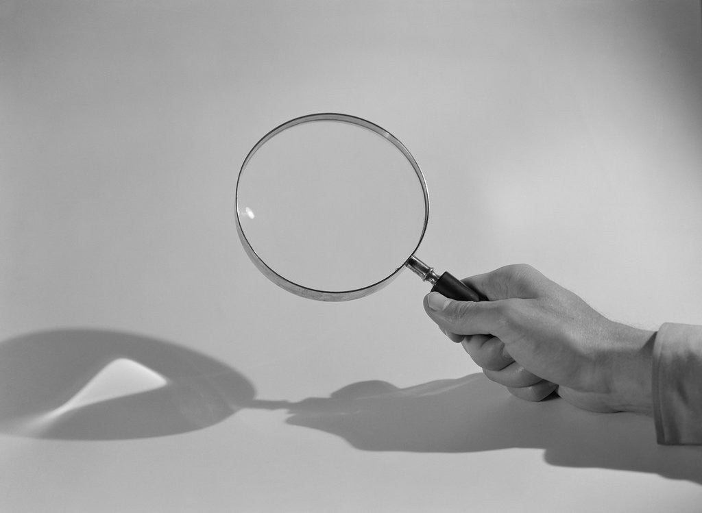 Detail of Hand Holding a Magnifying Glass by Anonymous