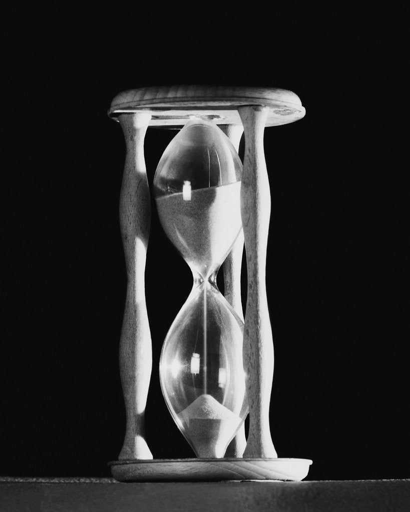 Detail of Sand Running Through Hourglass by Corbis