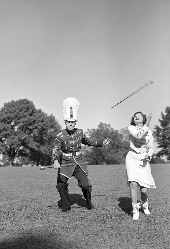 Detail of Band Members Twirling Batons by Corbis