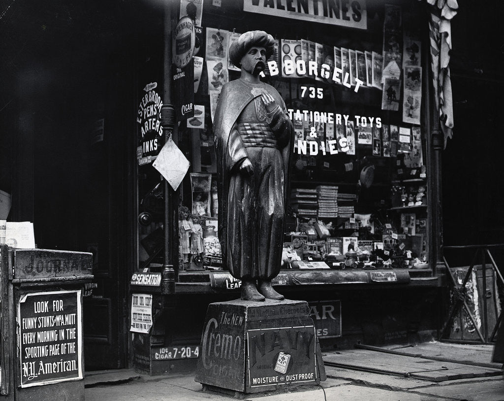 Detail of Wooden Statue In Front Of Shop Window by Anonymous