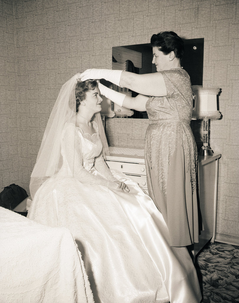 Detail of Mother Putting Bridal Veil on Daughter by Corbis