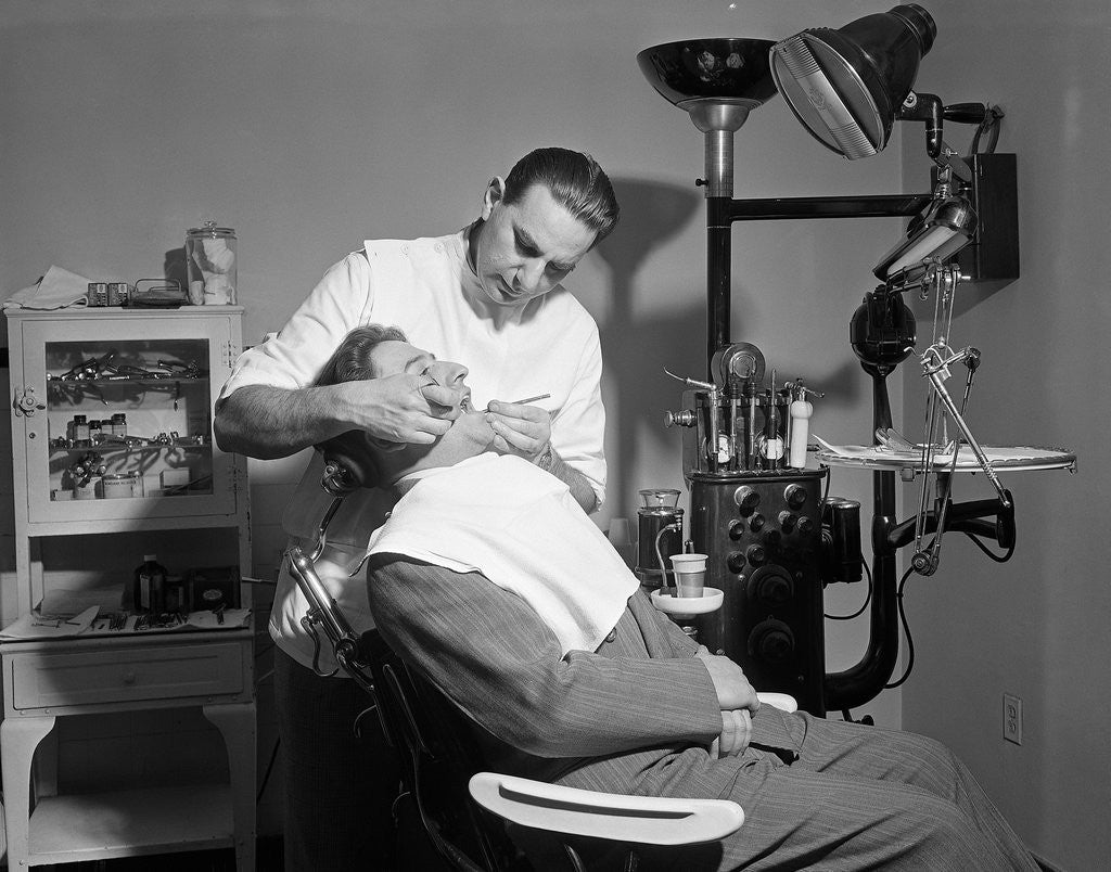 Detail of Dentist Working On Patient by Corbis