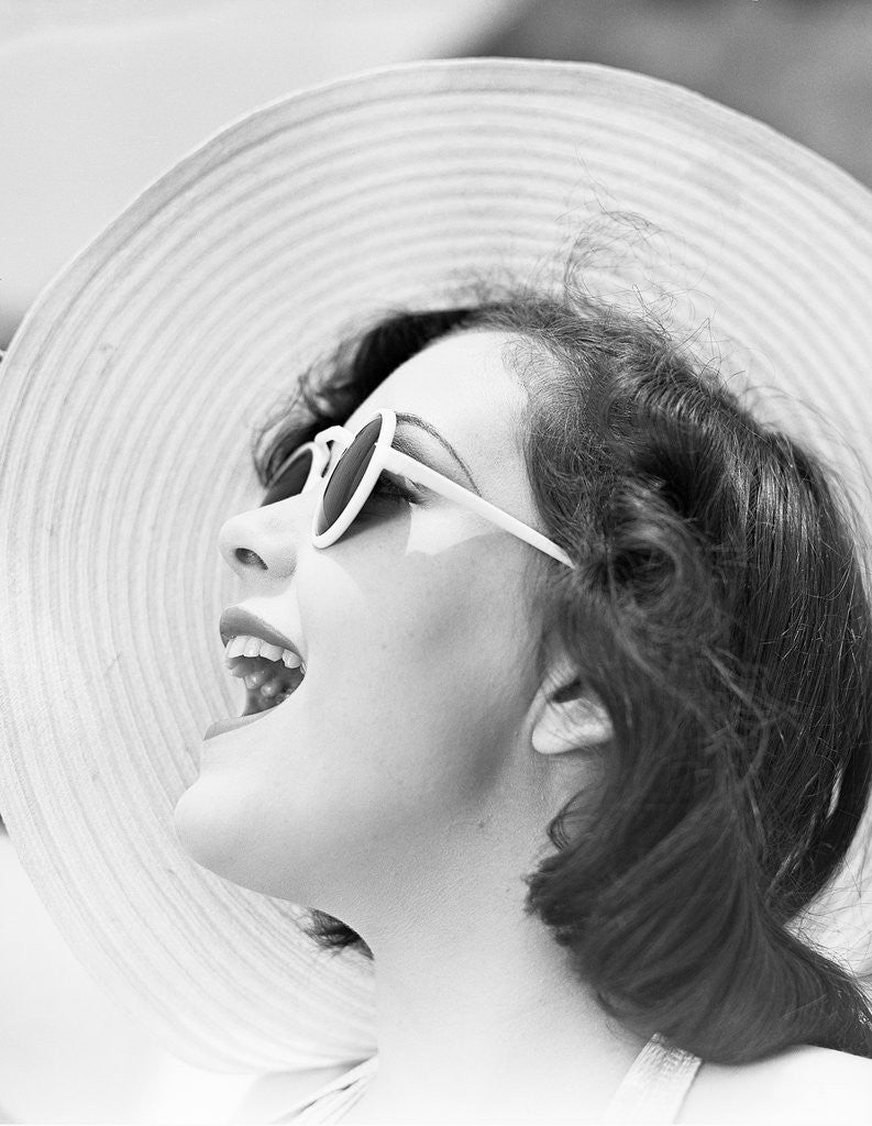 Detail of Woman with Sunglasses Wearing Straw Hat by Corbis