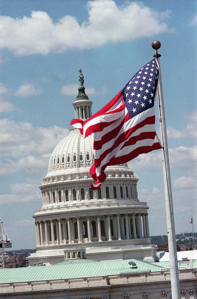 Detail of Flag Waving in Front of US Capitol Building by Corbis