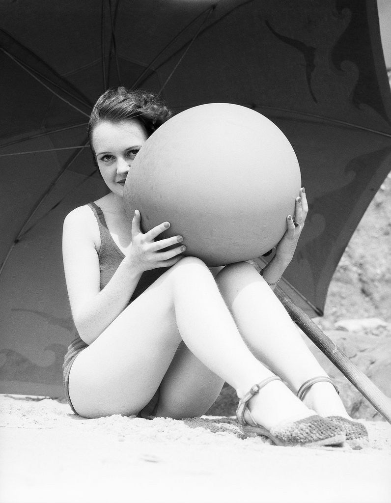 Detail of Woman in Bathing Suit Holding Beach Ball by Corbis