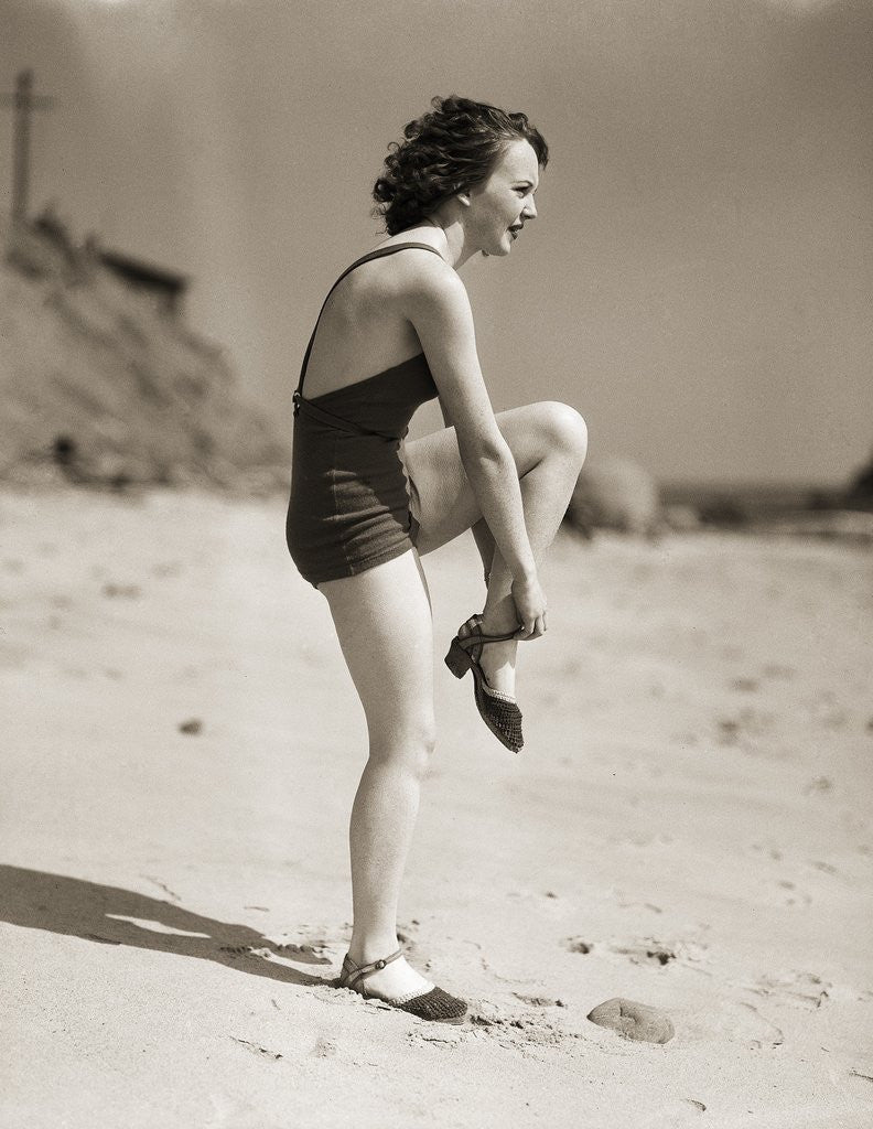 Detail of Woman Wearing Sandals at the Beach by Anonymous