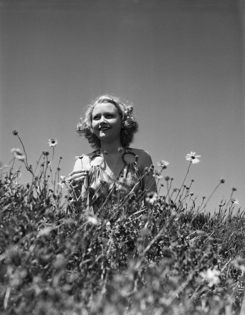 Detail of Woman in Wildflower Field by Corbis