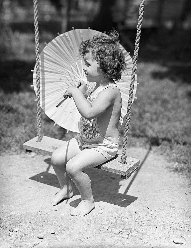 Detail of Girl on Swing Holding Parasol by Corbis