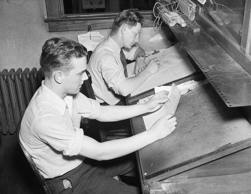 Detail of Men At Desks Proofreading Documents by Anonymous