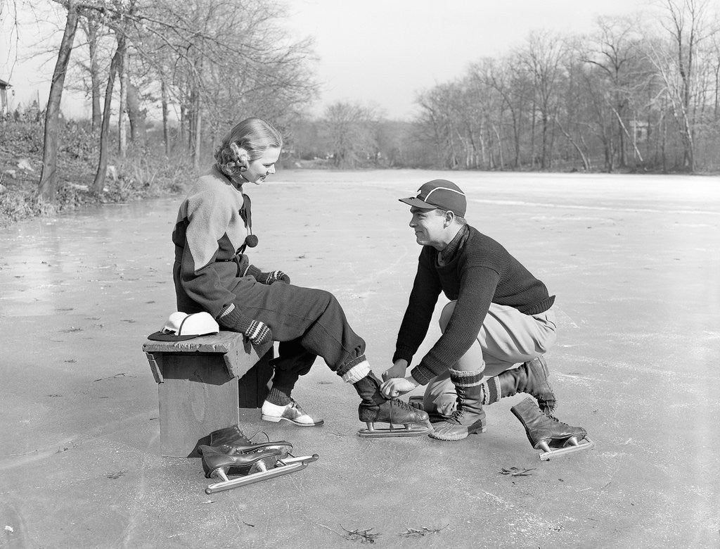 Detail of Man Lacing a Woman's Ice Skate by Anonymous