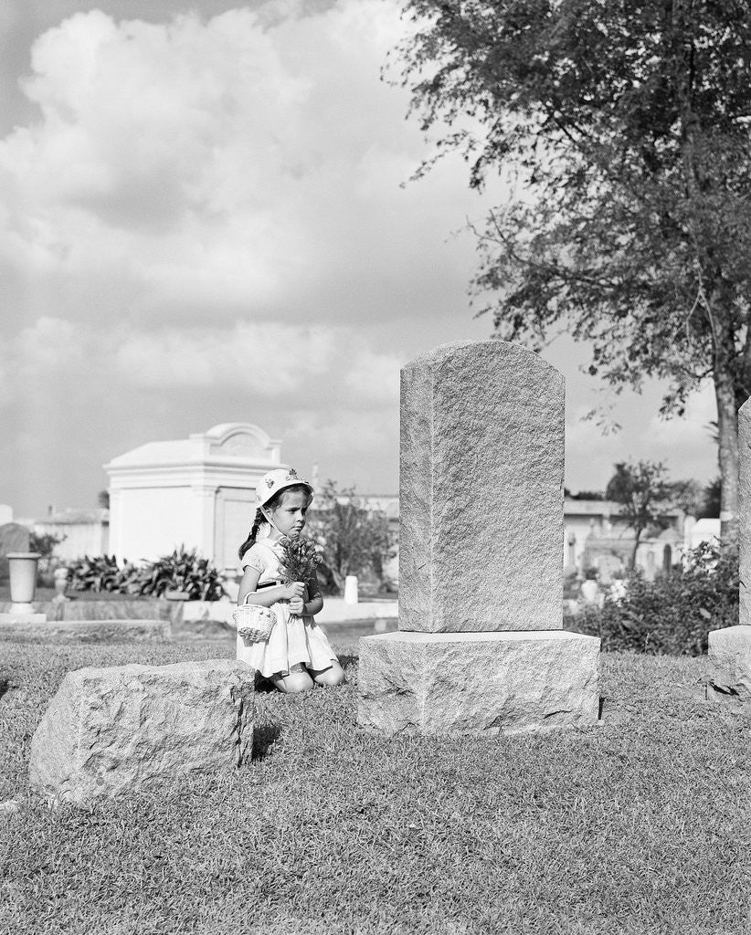 Detail of Girl Kneels at Headstone by Corbis
