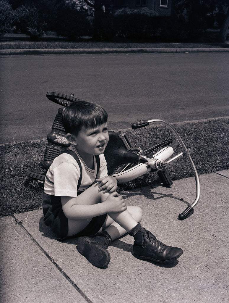 Detail of Boy Fallen Off Tricycle and Holding Knee by Anonymous