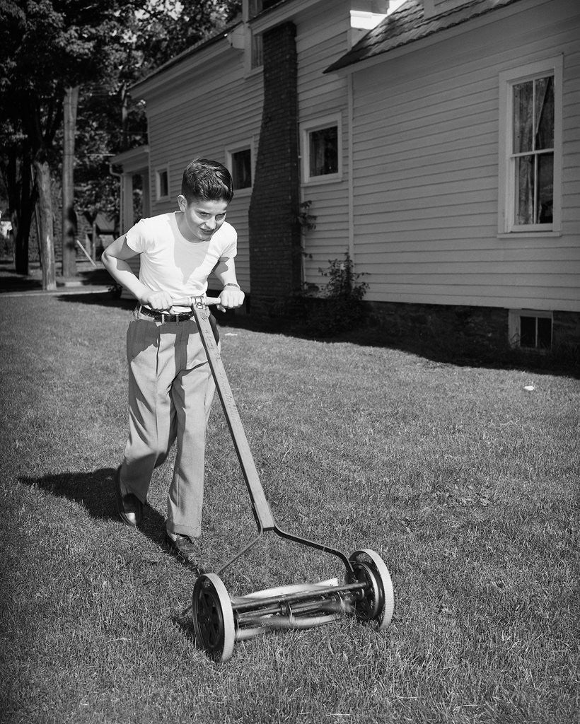 Detail of Boy Pushing Manual Lawnmower by Corbis