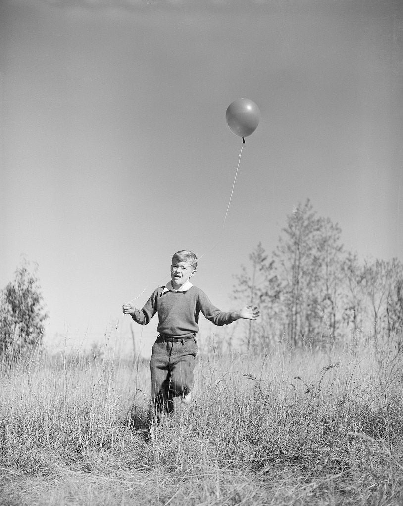Detail of Boy Holding a Balloon by Corbis