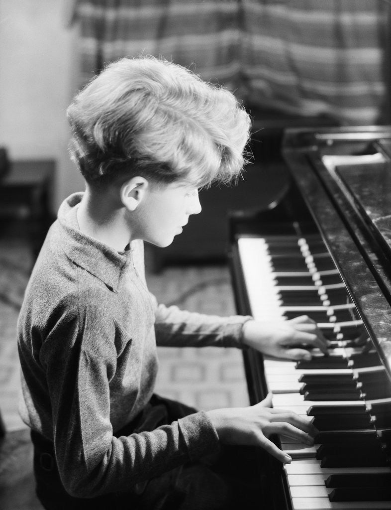 Detail of Boy Practicing Piano by Corbis