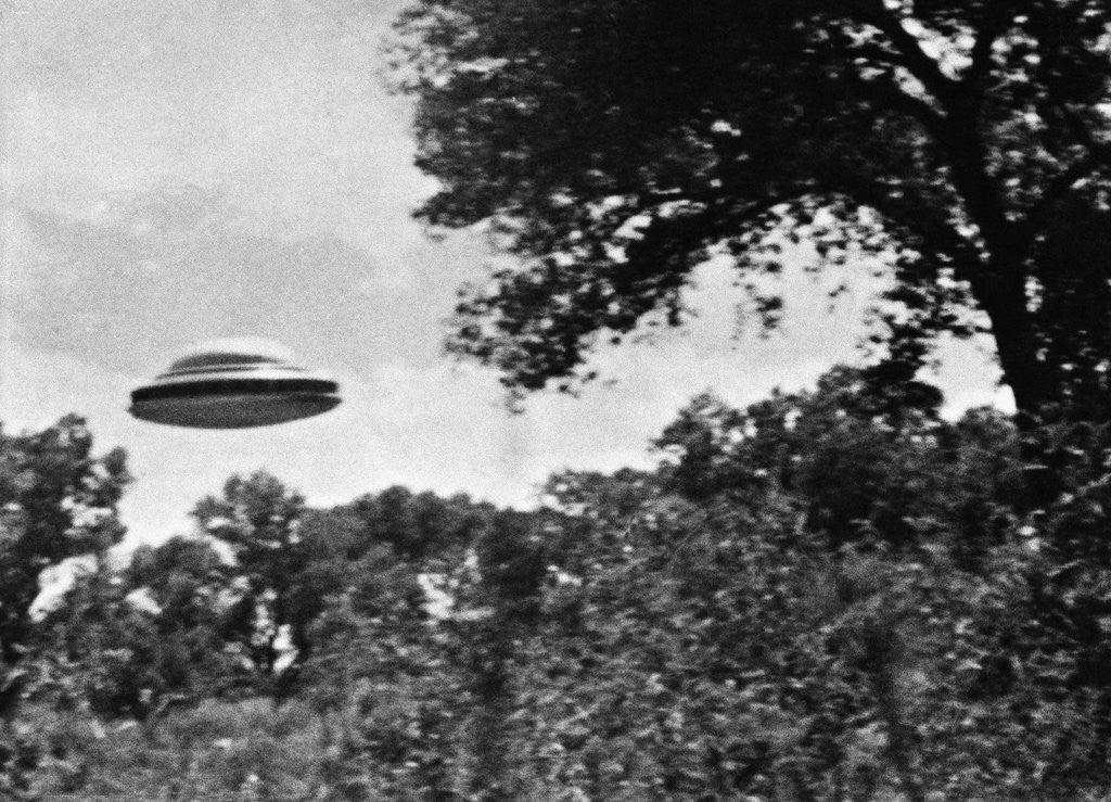 Detail of UFO Flying Low Over Trees by Corbis