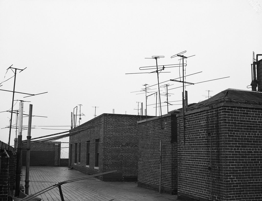 Detail of Antennas on Rooftop by Corbis