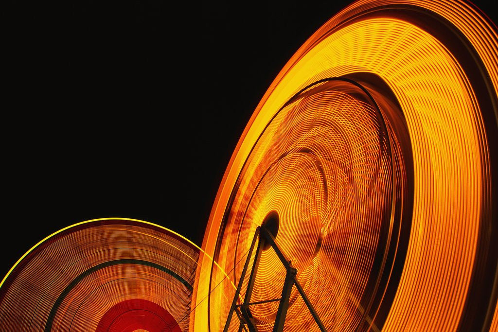 Detail of Spinning Ferris Wheels at Night by Anonymous