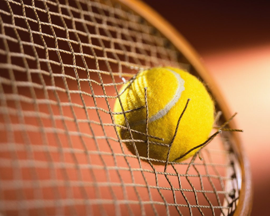 Detail of Tennis Racket Broken by Tennis Ball by Corbis