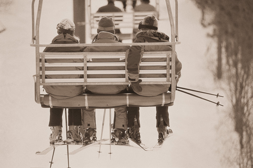 Detail of Skiers Riding Chair Lift by Anonymous