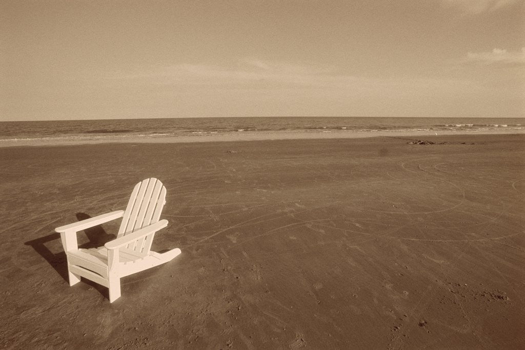Detail of Lone Chair on Empty Beach by Corbis