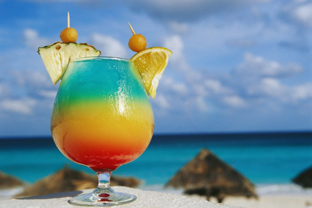 Detail of Tropical Drink Before Beach and Ocean by Corbis