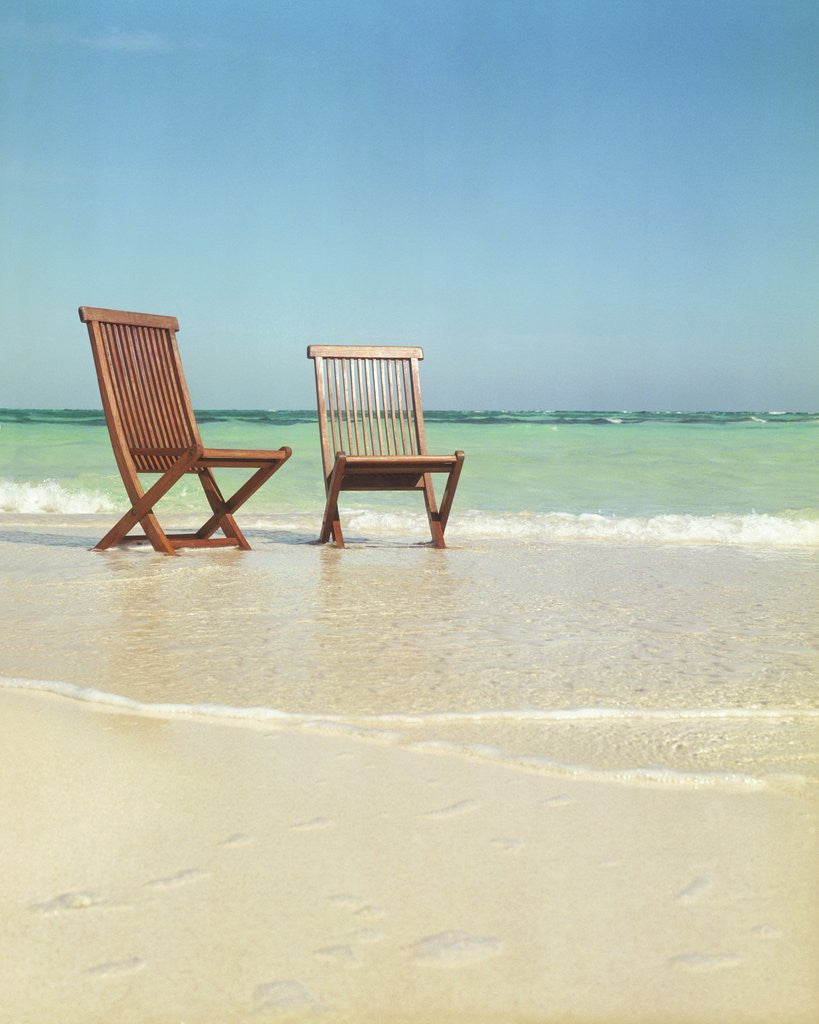 Detail of Pair of Wooden Lounge Chairs on Beach by Anonymous