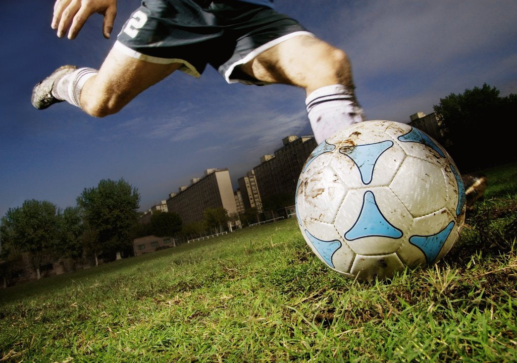 Detail of Soccer Player Kicking Ball by Anonymous