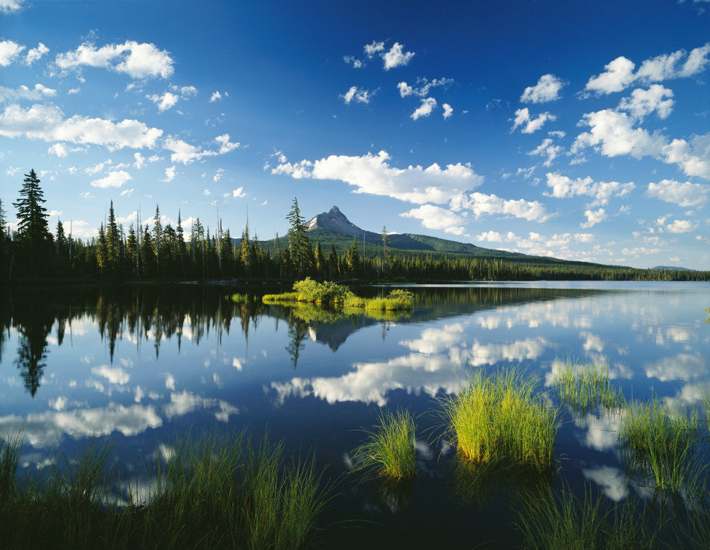 Detail of Clouds in Sky Reflected by Mountain Lake by Anonymous