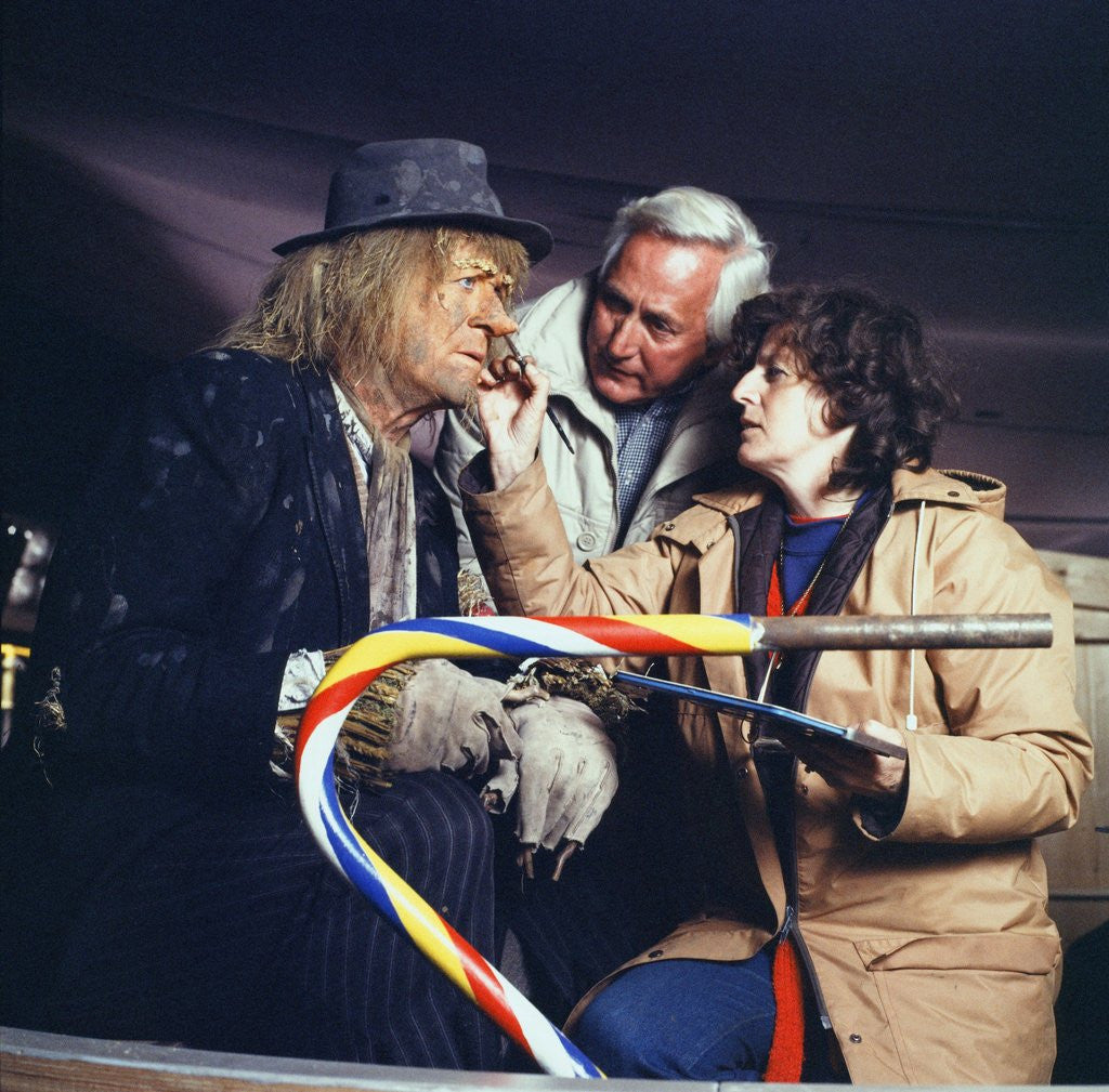 A make-up artist touches up Jon Pertwee's make-up by Anonymous