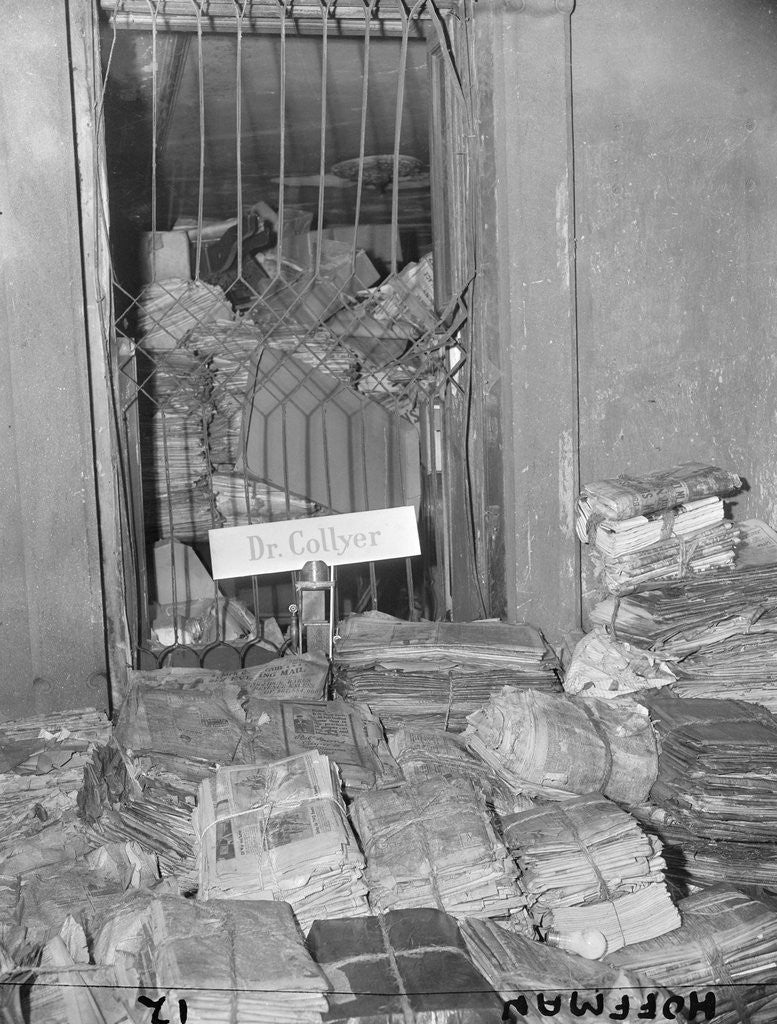Detail of Newspapers Piled High in a Room by Corbis