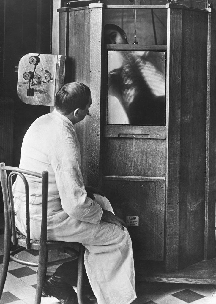 Detail of Doctor Using a Fluoroscope by Corbis