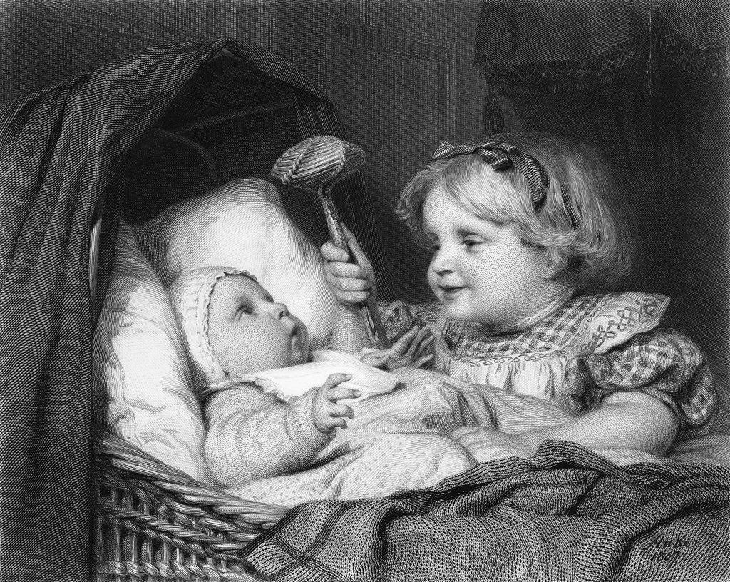 Detail of Girl Waving Rattle at Infant by Corbis