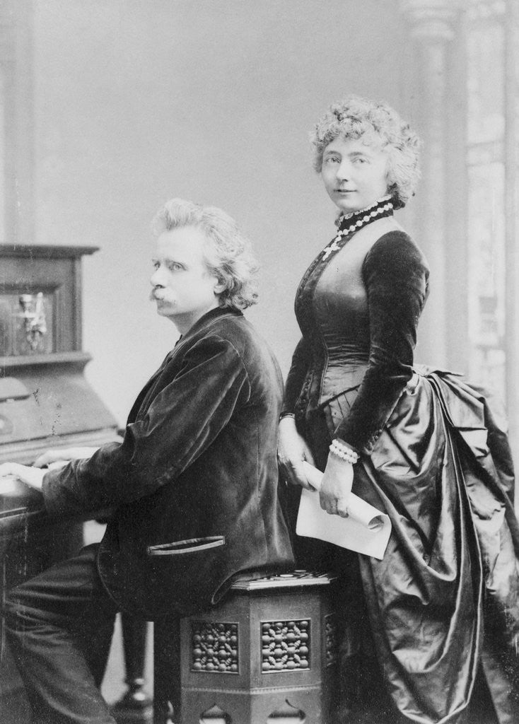 Detail of Evard Grieg Playing Piano with Wife Looking On by Anonymous
