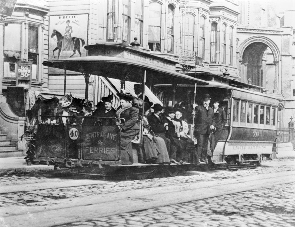 Detail of Passengers Riding Cable Car by Corbis