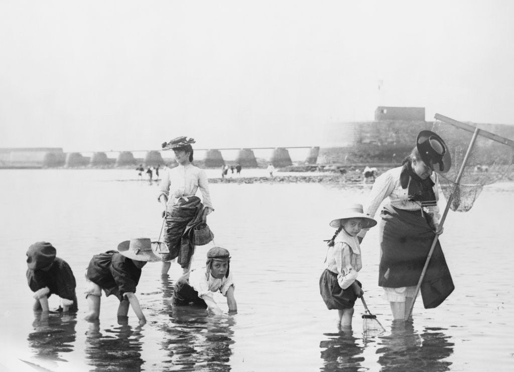 Detail of Children Crabbing on the Seashore by Corbis