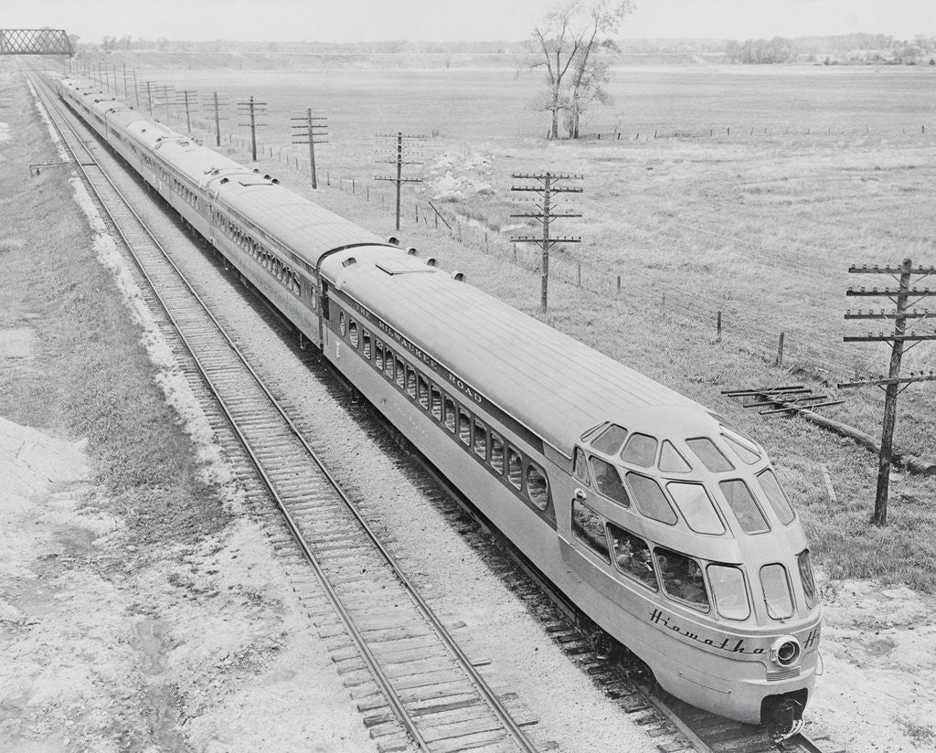 Detail of Streamlined Train Cars on Daytime Schedule by Anonymous