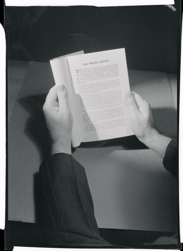 Detail of Hands Holding Open Booklet by Anonymous
