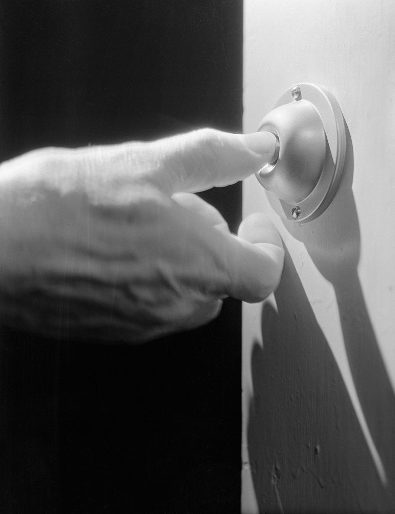 Detail of Hand Pressing a Door Bell by Corbis