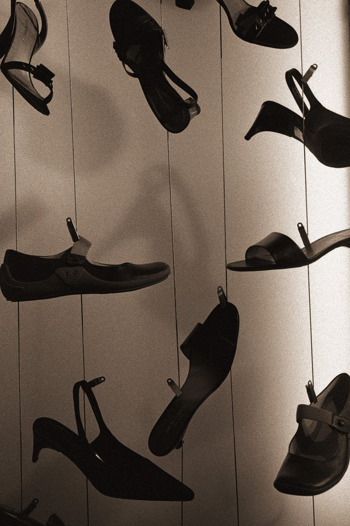 Detail of Ladies Shoes Hanging on Wire by Corbis