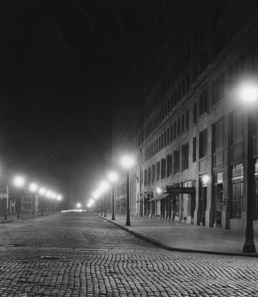 Detail of Street Lights Along a Cobblestone Street by Anonymous
