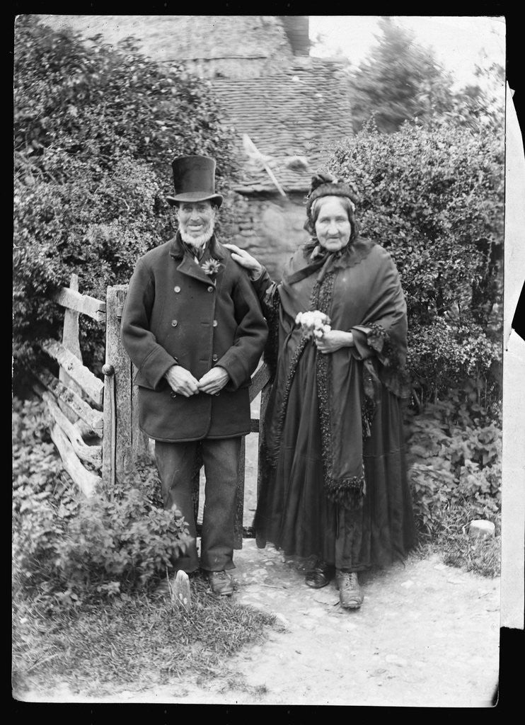 Detail of Elderly Couple Standing by Fence by Anonymous