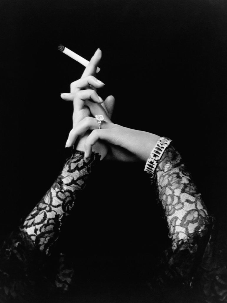 Detail of Woman's Hands Holding Cigarette by Corbis