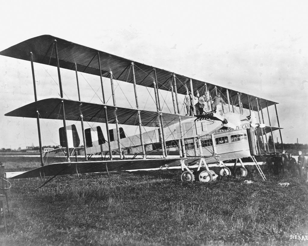 Detail of Passengers Standing on Middle Wing of Triplane by Anonymous