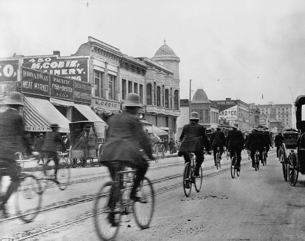 Detail of Los Angeles Police Officers Bicycling Past Broadway Storefronts by Anonymous