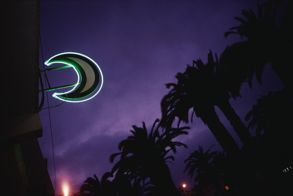 Detail of Neon Crescent Moon Above Pharmacy by Corbis