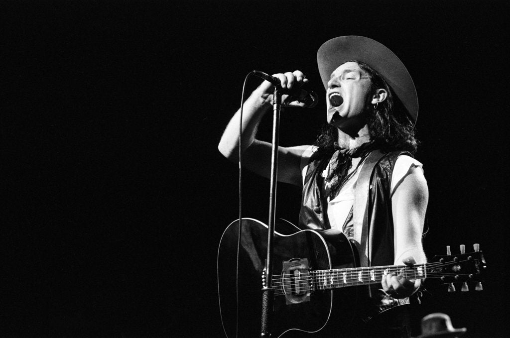 Detail of U2 performing at the NEC 1987 by Reavenall