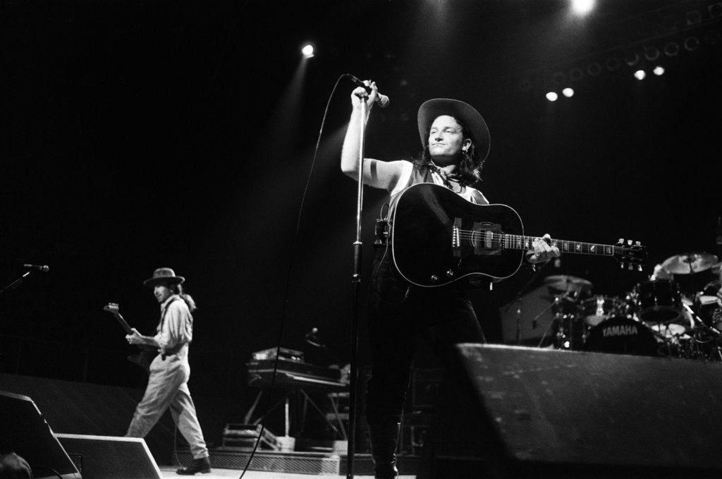 Detail of U2 performing at the NEC 1987 by Reavenall